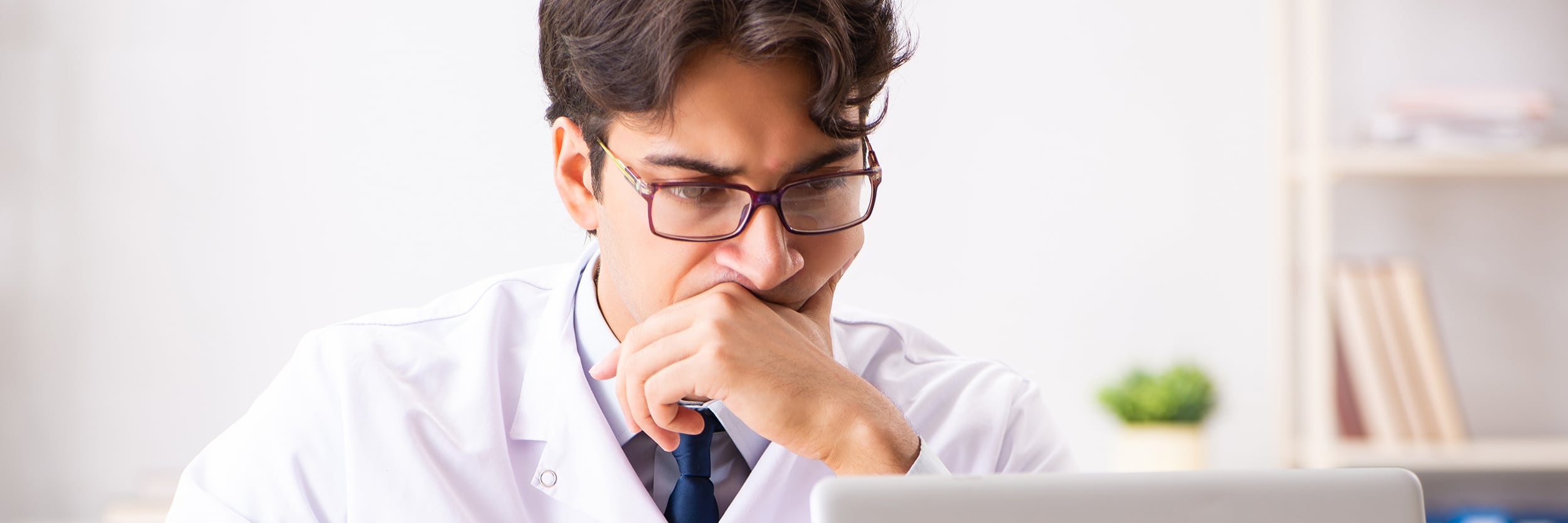 young handsome doctor oculist working at the clinic