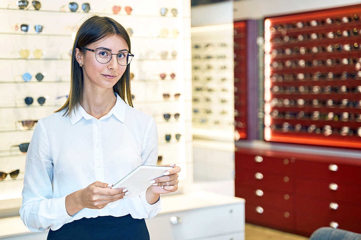 eye doctor sitting in front of laptop