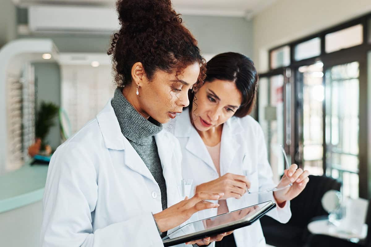 eye-doctor-sitting-in-front-of-laptop eye doctor sitting in front of laptop