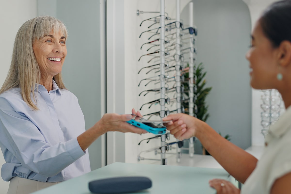 eye-doctor-sitting-in-front-of-laptop eye doctor sitting in front of laptop