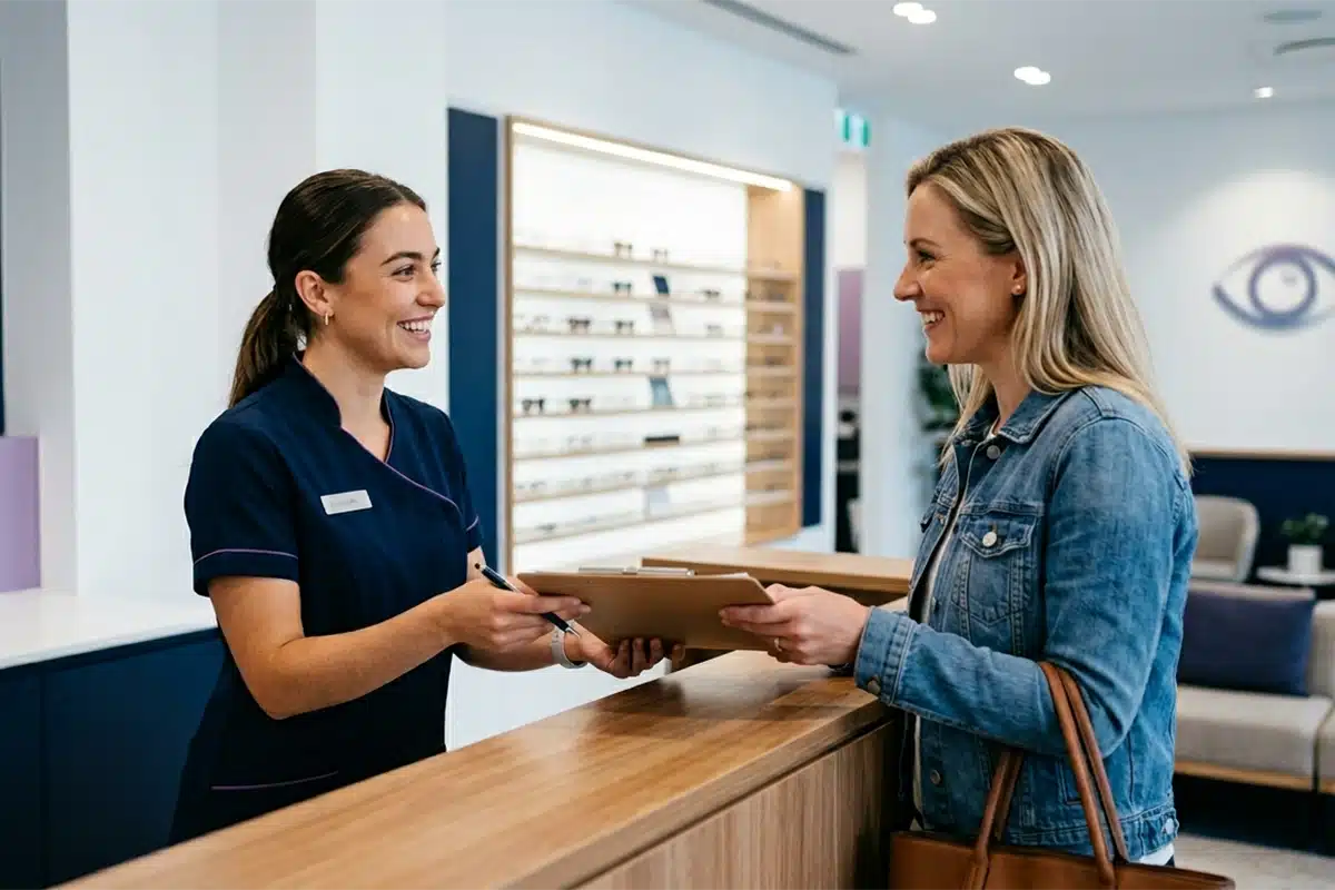 eye doctor sitting in front of laptop
