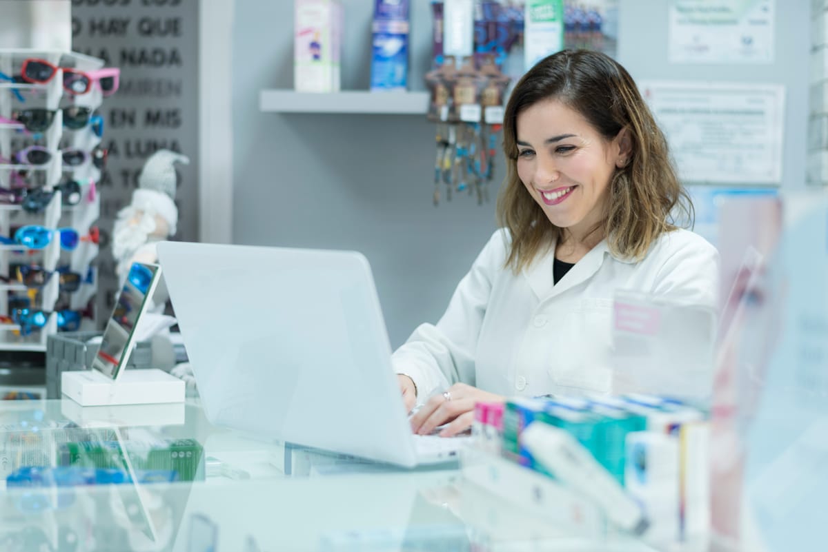 eye doctor sitting in front of laptop