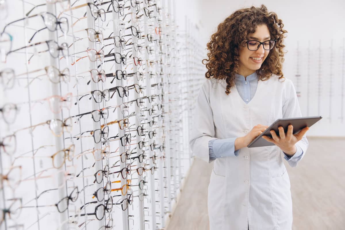 eye-doctor-sitting-in-front-of-laptop eye doctor sitting in front of laptop