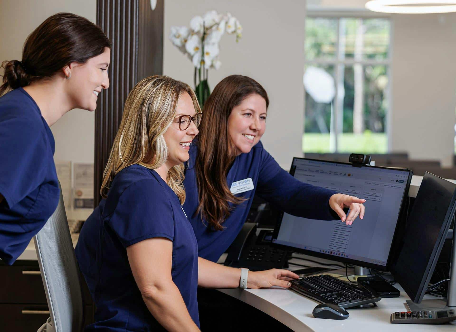nurses looking at administrative software
